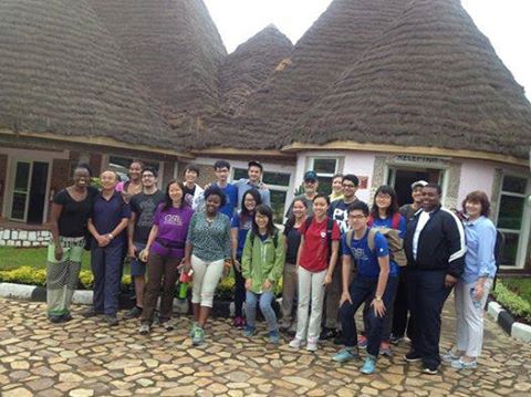 The group of students outside a school