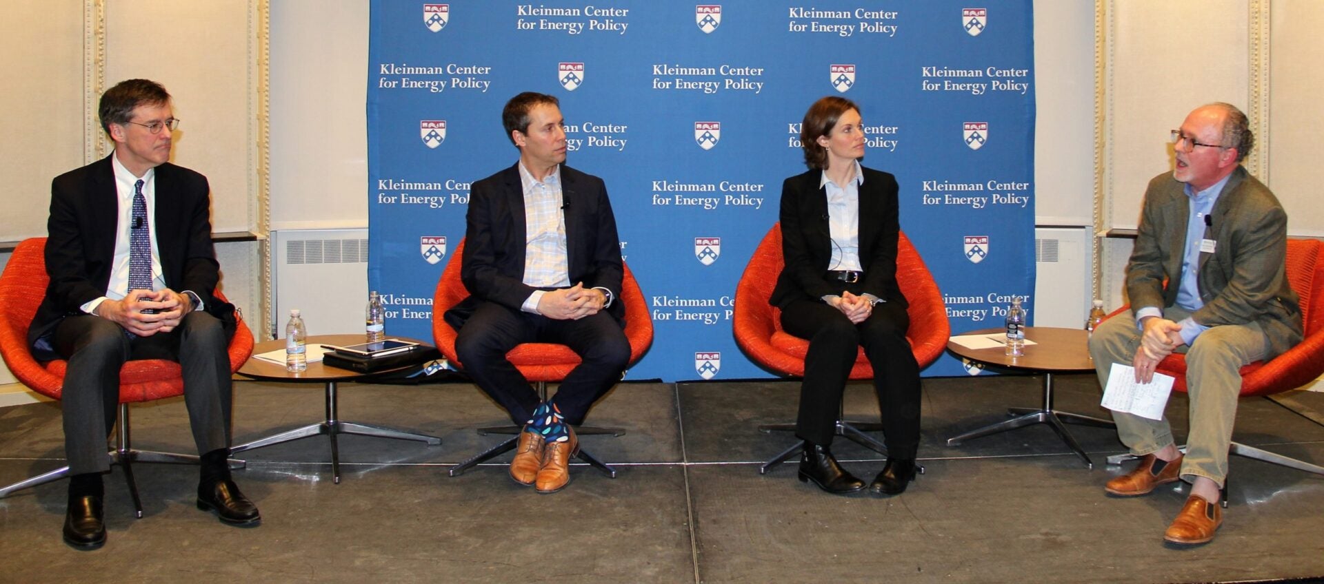 A group of panelists in front of the Kleinman stage