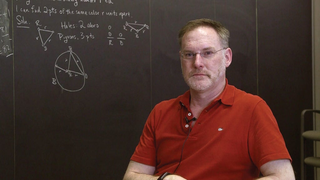 Rob Carpick in front of a chalkboard
