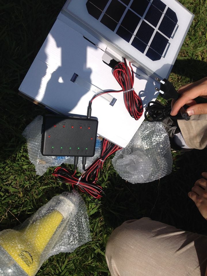 A solar panel and wires on the ground