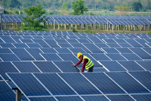 Engineers or operators are checking the solar panel.