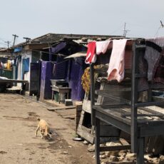 This informal settlement in Accra, Ghana lacks basic infrastructure of which electricity is one element. The electrical lines seen in the background of the photo are the fragile and irregularly placed. (Source: Eugénie L. Birch)