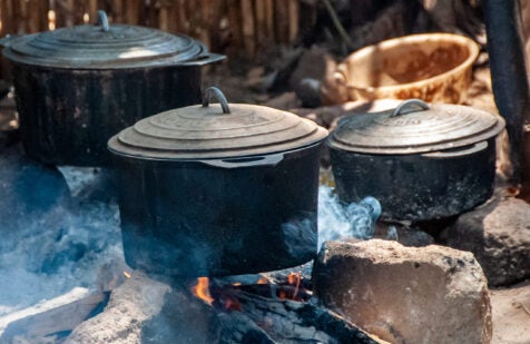 Old pots on the wood fire of a kitchen of the village of Bekopaka in the west of Madagascar