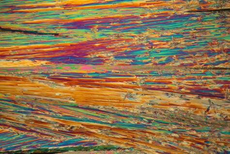 Neodymium is a rare earth element. The crystals are precipitated from a solution on a microscope slide and photographed in polarized light.
