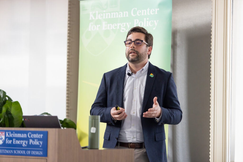 Danny Cullenward presents at the Kleinman Center lectern 
