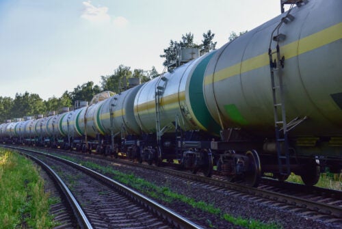 Transport tank car LNG by rail, gas - oil products. LPG transport propane. The fuel train, rolling stock with petrochemical tank cars. Liquefied natural gas export.