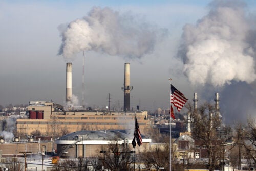 Steam and pollution rise on a cold day at the Arapaho Station Coal Power Plant, a coal fired Xcel power plant along the Platte River in Littleton, just outside Denver, Colorado.