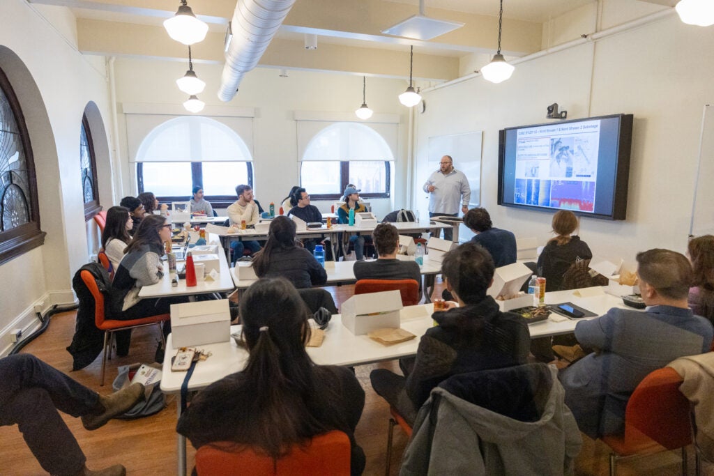 Ben Schmitt guides students through his latest report on underwater energy infrastructure sabotage.